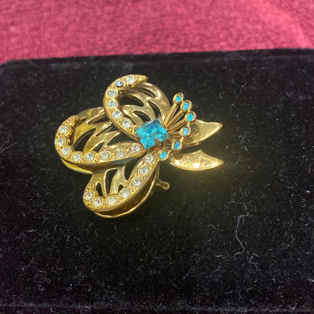 Vintage gold/blue stones, and crystal brooch.